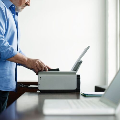 img of someone using a printer
