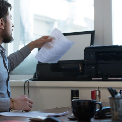 img of someone using a printer
