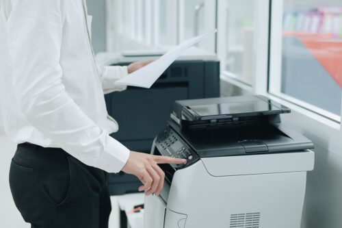 man using printer in office